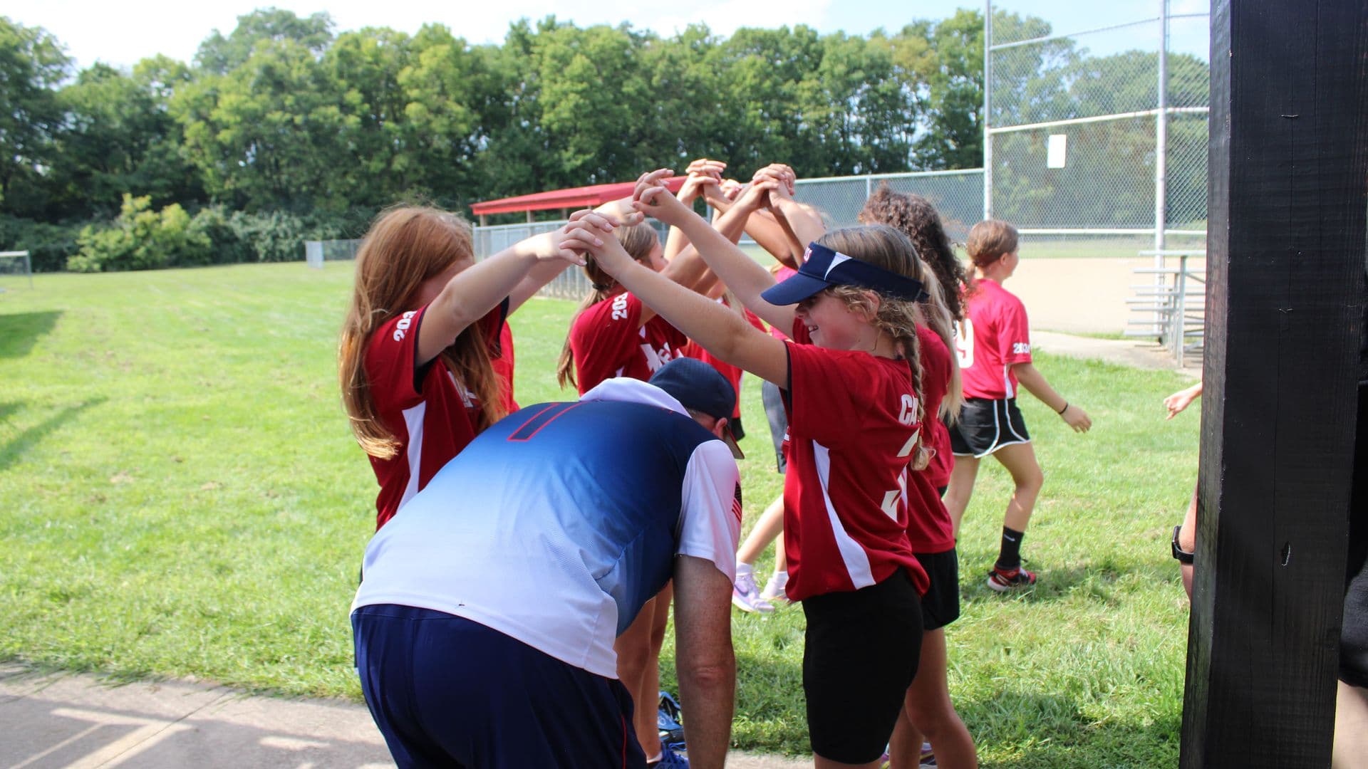 Xpress players bring it in for a team huddle on Signing Day